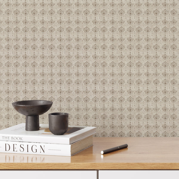 Taupe damask wallpaper with faded floral ornaments on a warm beige background and distressed texture, ideal for a French country bedroom or living room.