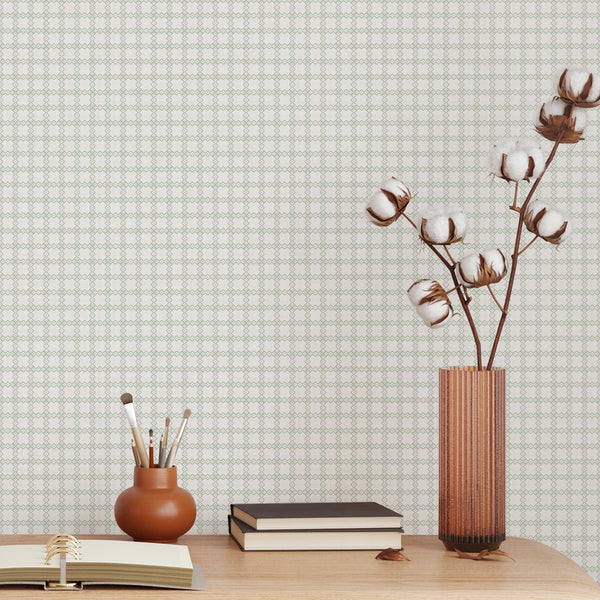 Sage green geometric wallpaper with a repeating trellis pattern on a gray textured background, ideal for a modern bedroom or living room.