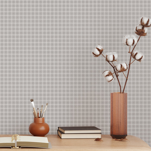 Gray patterned wallpaper with a timeless white geometric lattice design and subtle texture for a modern bedroom, living room or entryway accent wall.