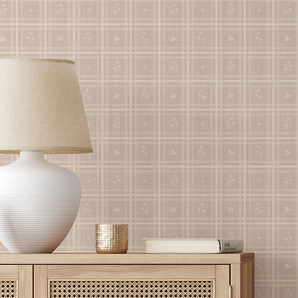 Taupe beige floral wallpaper with a subtle checked grid and tiny floral vignettes. The warm beige and light taupe palette creates a soft, inviting atmosphere perfect for nurseries or bedrooms. Made in the USA, this removable peel and stick wallpaper is eco-friendly, easy to apply, and ideal for renters seeking a cozy cottage aesthetic.