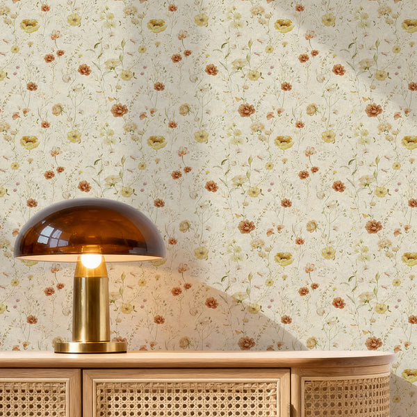 Beige wildflower wallpaper with delicate watercolor flowers in rust, muted yellow, cream and soft green for a vintage cottagecore bedroom or nursery.