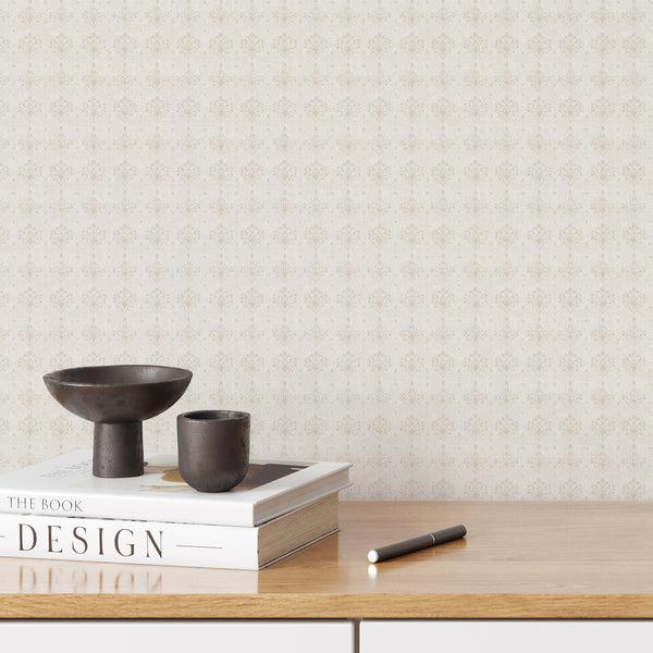 Light beige damask wallpaper with soft floral ornamental motifs and a subtle distressed texture, ideal for a neutral French country bedroom or living room.