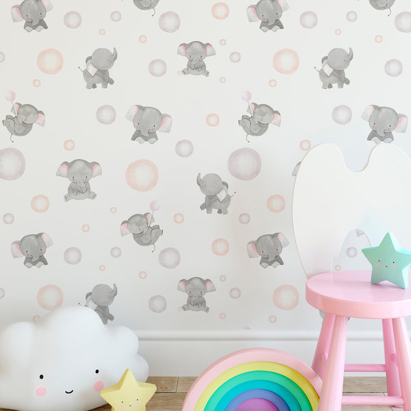 Watercolor elephant nursery wallpaper with soft gray baby elephants, blush pink ears, pastel balloons, and gentle dots on white background.
