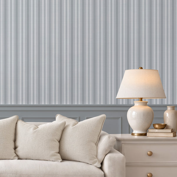 Blue gray and white striped wallpaper featuring narrow vertical woven-style lines with delicate herringbone detailing, ideal for English country cottage bedroom decor.