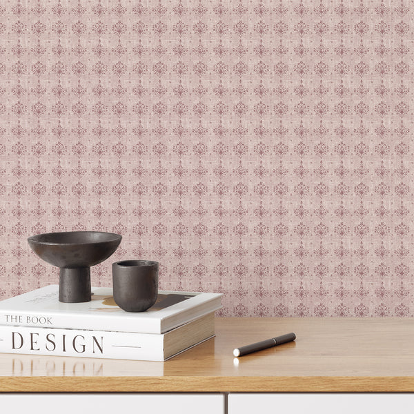 Dusty pink damask wallpaper with faded floral ornaments and a softly distressed texture, ideal for a romantic bedroom or French country interior.