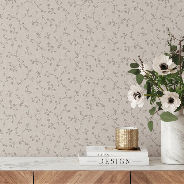 Beige wallpaper with hand-drawn floral vines, perfect for living rooms desiring a neutral, breathable backdrop.