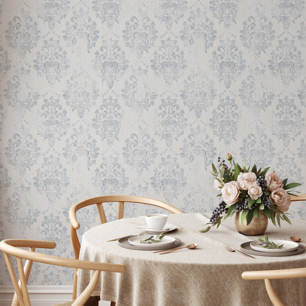 Distressed blue-gray damask wallpaper, offering a relaxed elegance for a living room. Traditional unpasted wallpaper, easy to reposition, perfect for designers.