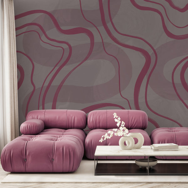 Dusty mauve and gray abstract wallpaper featuring oversized flowing curved lines and soft textured layers for a modern minimalist bedroom interior.