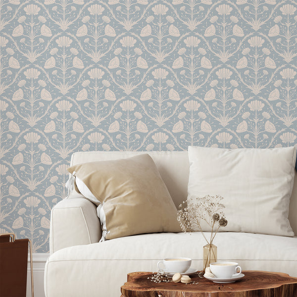 Blue vintage floral wallpaper with compact blooms, creating a cozy feel in a cottage bedroom. Removable peel and stick design, ideal for heritage decor.