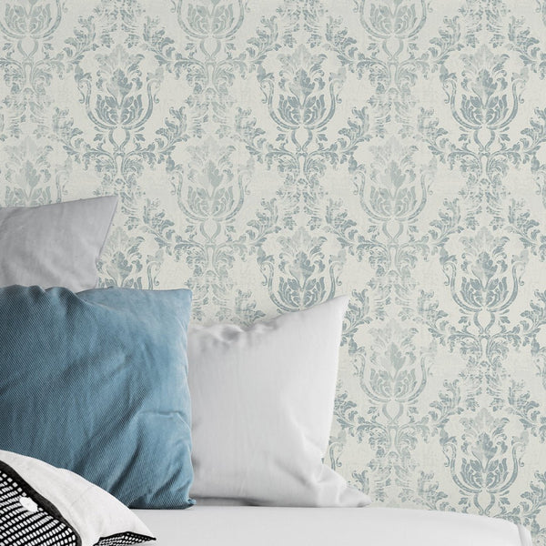 Light Blue Rococo wallpaper features ornate rococo cartouches and scrolling foliage in muted blue tones. Ideal for adding timeless elegance to a bedroom or traditional living room. Made from eco-friendly materials, it's perfect for a vintage-inspired decor.
