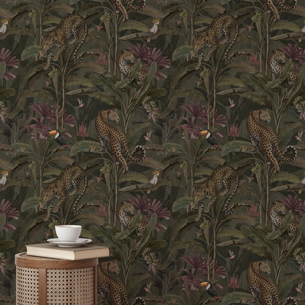 Dark tropical leopard wallpaper featuring spotted wild cats, exotic toucans and lush banana leaves against a moody olive green jungle background.