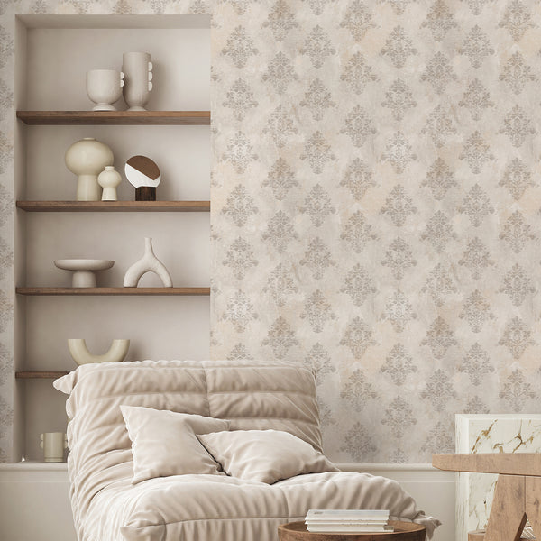 Beige damask wallpaper with a faded ornamental floral pattern and distressed plaster-like background, ideal for French country and vintage interiors.