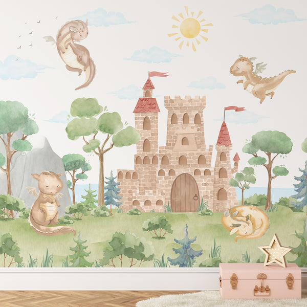 Watercolor dragon castle wall mural featuring cute baby dragons, a medieval stone castle, green forest, mountains and soft blue clouds for a nursery.