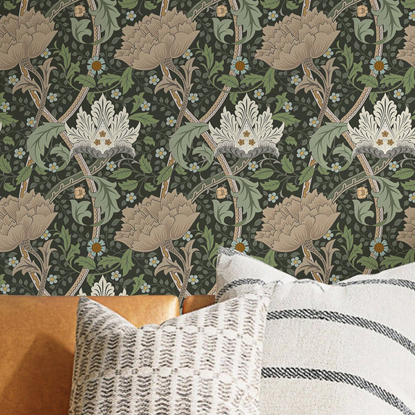 Bold botanical wallpaper featuring oversized flowerheads and scrolling stems in beige and pale sage on a deep near-black green background. Ideal for creating a statement wall in living rooms or dining rooms with its intricate engraved-style linework and tiny blue accents, offering a classic yet graphic floral design.