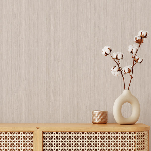 Beige vertical texture wallpaper with fine strié grain lines, perfect for creating a serene atmosphere in living rooms or bedrooms. This removable peel and stick wallpaper adds height and sophistication to Japandi or minimalist spaces with its subtle two-tone effect and woven-like appearance.