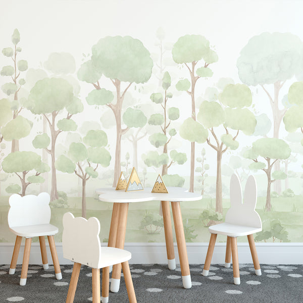 Whimsical woodland nursery wallpaper featuring pastel green trees, beige trunks, and a dreamy watercolor forest landscape for a peaceful baby room.