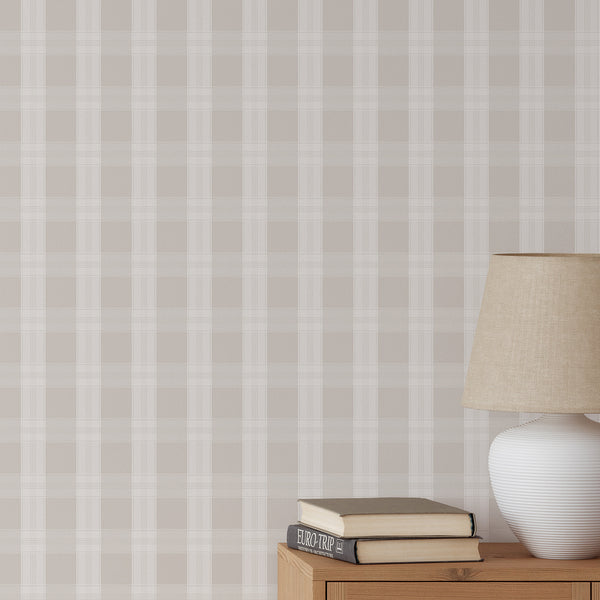 Neutral beige plaid wallpaper with soft taupe tones and oversized check lines, creating a clean preppy look for a nursery, bedroom, or living room.