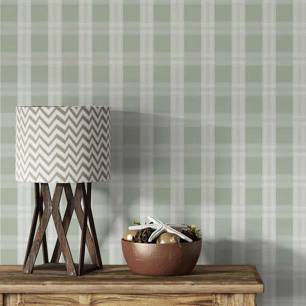 Sage green plaid wallpaper with soft cream checks and delicate intersecting lines, creating a timeless pattern for bedrooms, nurseries, and living rooms.