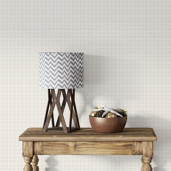Vintage beige damask wallpaper featuring delicate botanical ornaments and a faded textured finish, ideal for farmhouse and French country home decor.