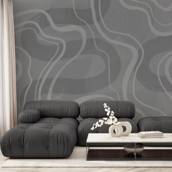 Gray abstract wallpaper featuring oversized white flowing curved lines and layered textured gray tones for a modern minimalist bedroom or living room.