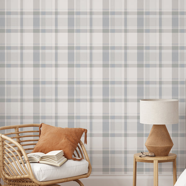Dusty blue gray plaid wallpaper featuring a vintage tartan check pattern with subtle woven texture, perfect for a cozy English country cottage bedroom.