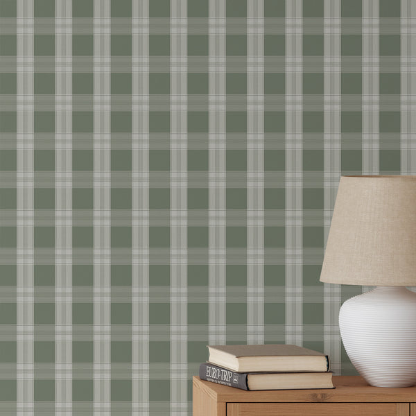 Sage green plaid wallpaper with soft white check lines and an oversized grid pattern, creating a polished cozy look for a nursery, bedroom, or living room.