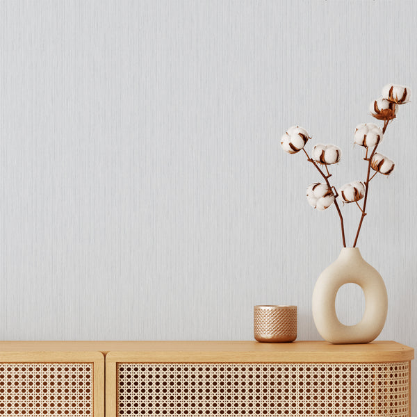 Light Blue Vertical Texture Wallpaper with a pale blue-gray shade and hand-drawn pinstripes. Ideal for Japandi living rooms, minimalist bedrooms, and bright home offices, this removable peel and stick wallpaper adds gentle height and a tailored feel, perfect for renters and decorators seeking eco-friendly options.
