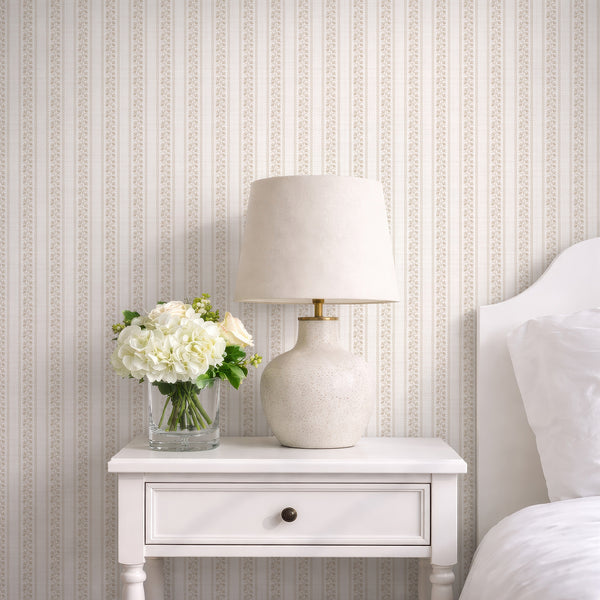 Beige floral stripe wallpaper with lace inspired botanical vines, wavy borders, and soft neutral texture for bedroom or nursery walls.