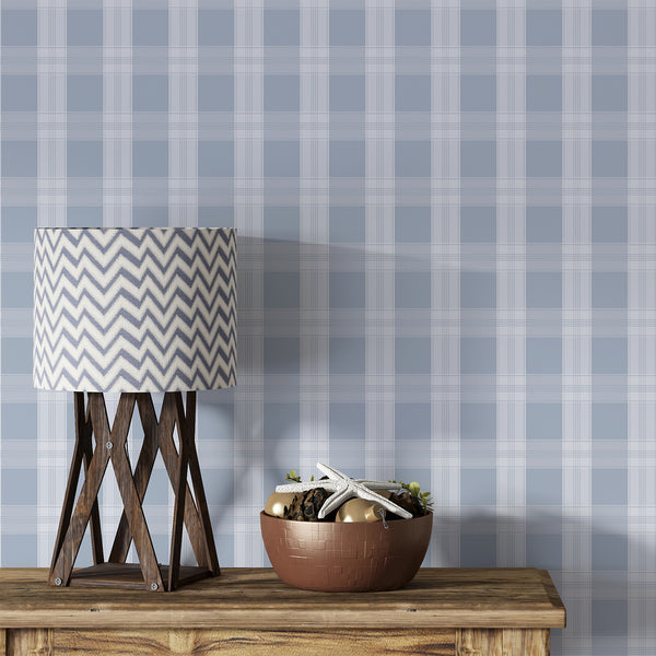 Dusty blue plaid wallpaper with soft white checks and fine intersecting lines, creating a timeless pattern for bedrooms, nurseries, and living rooms.
