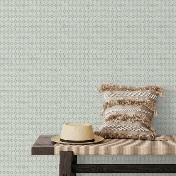 Sage green minimalist geometric wallpaper with a tiny distressed diamond lattice adds subtle pattern to hallways and bedrooms. The removable peel and stick option is eco-friendly and Made in the USA, perfect for modern minimalist and Scandinavian interiors.