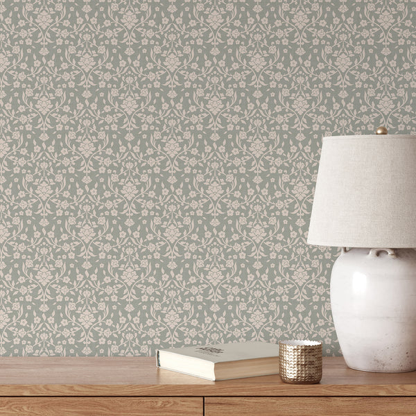 Sage green floral damask wallpaper featuring large cream flowers, flowing botanical vines and decorative leaves on a muted green background with woven texture.