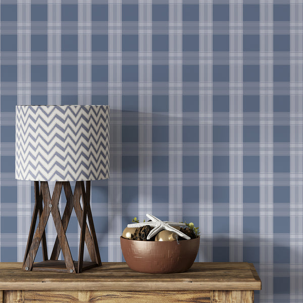 Navy blue plaid wallpaper with soft blue-gray checks and fine intersecting lines, creating a tailored pattern for bedrooms, nurseries, and living rooms.
