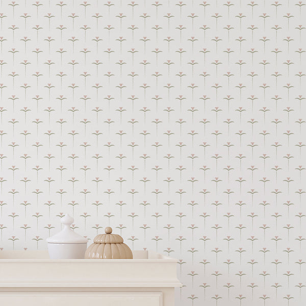 Minimalist botanical wallpaper featuring small pink flowers and soft green leaves in an evenly spaced pattern, ideal for a nursery or bedroom.