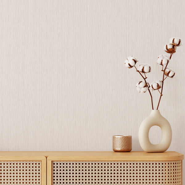 Neutral beige vertical texture wallpaper with hairline striations resembling brushed linen, ideal for Japandi and modern spaces.