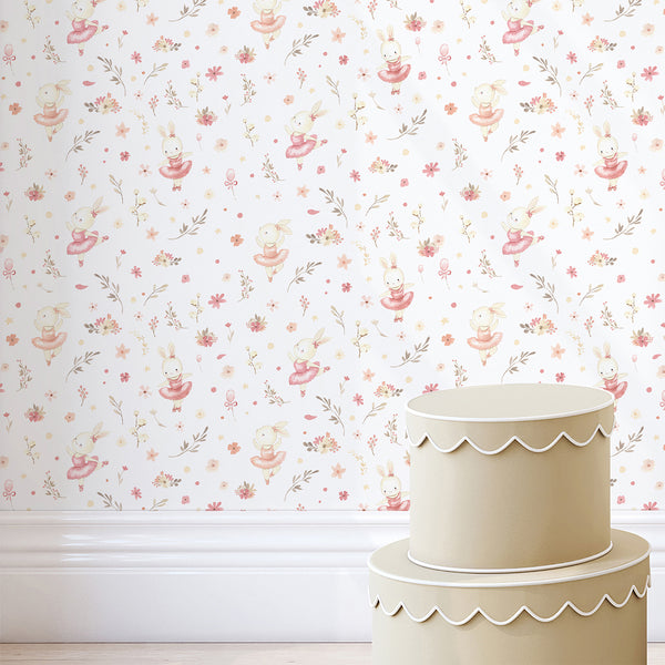 Floral bunny wallpaper featuring a graceful rabbit ballerina, soft pink blossoms, botanical sprigs, and tiny decorative shapes for a kids bedroom.