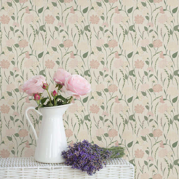 Pink and sage green botanical wallpaper featuring stylized flowers, leaves and slender stems on a textured cream background.