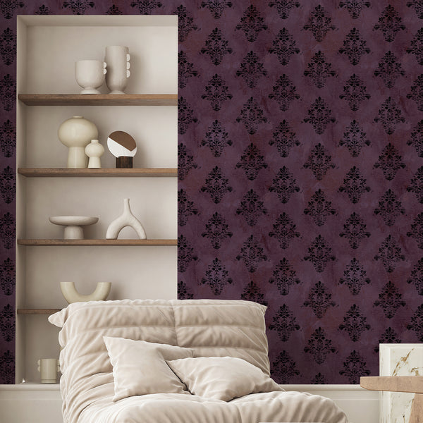Purple and black damask wallpaper featuring weathered floral motifs and a distressed finish for dramatic Victorian, gothic and dark academia decor.