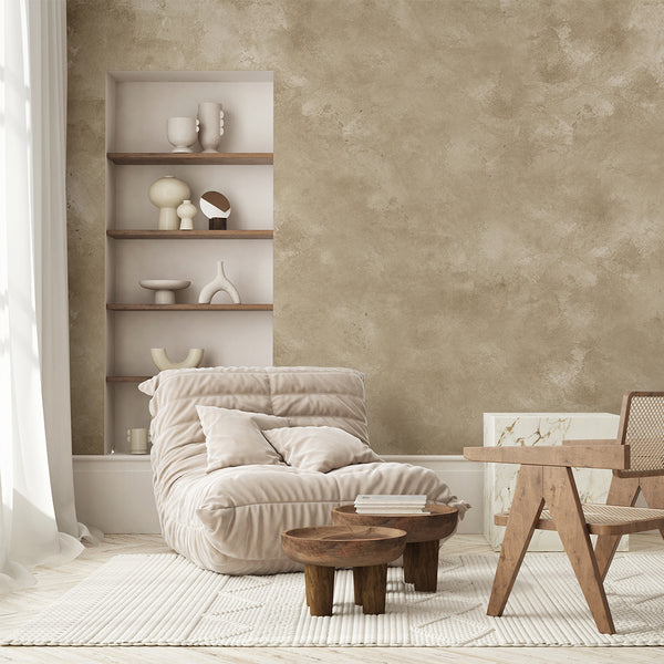 Detail of Limewash Plaster Wall Mural showing weathered plaster look with diffuse patches and subtle mottling. Warm mid-beige to light tan palette suits minimalist interiors. Perfect for entryways or bedrooms, offering a calming, textured wall surface. Made in the USA, this pre-pasted wallpaper is easy to apply, reposition, and suitable for decorators.