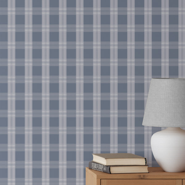 Blue plaid wallpaper with soft white check lines and an oversized grid pattern, creating a polished preppy look for a nursery, bedroom, or living room.