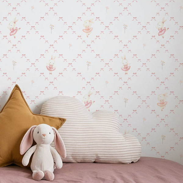 Soft pink bunny ballerina wallpaper with a watercolor rabbit in a blush tutu, delicate ribbon bows, and a tiny flower on a white background.