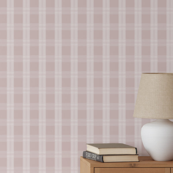 Blush pink plaid wallpaper with soft white check lines and an oversized grid pattern, creating a sweet cozy look for a nursery, bedroom, or living room.