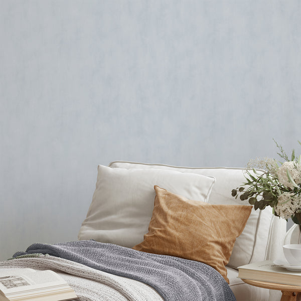 Pale Blue Plaster Look Wallpaper featuring a serene limewash effect with soft cloud-like mottling, ideal for Japandi or Scandinavian interiors.