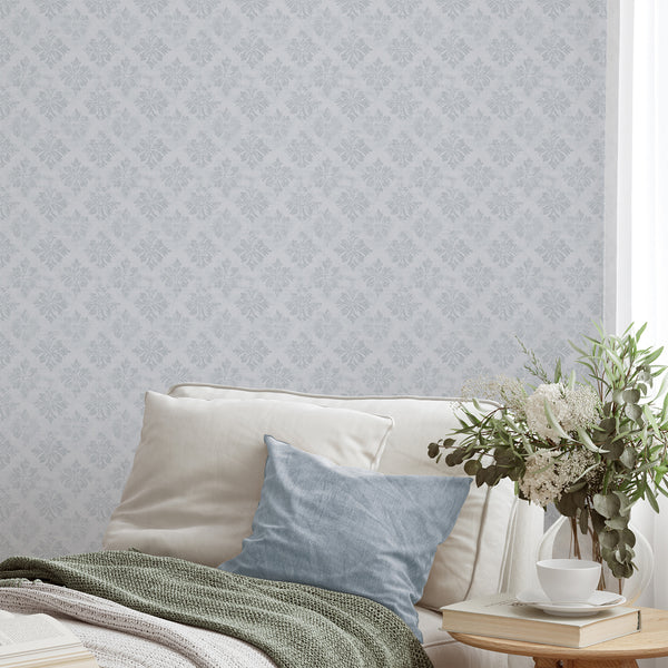 Gray blue floral damask wallpaper showcasing elegant medallion motifs on a near-white ground, ideal for creating a calm, vintage ambiance in bedrooms or living rooms.