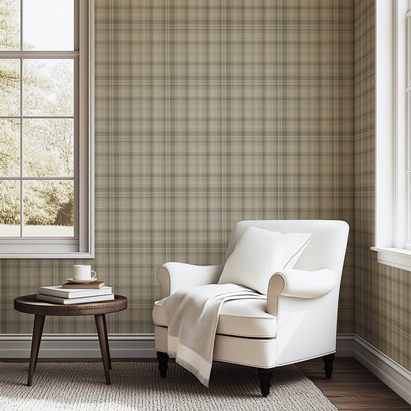 Sage green plaid wallpaper featuring a vintage tartan check pattern with muted green, warm beige, and soft gray tones for a cozy farmhouse bedroom accent wall.