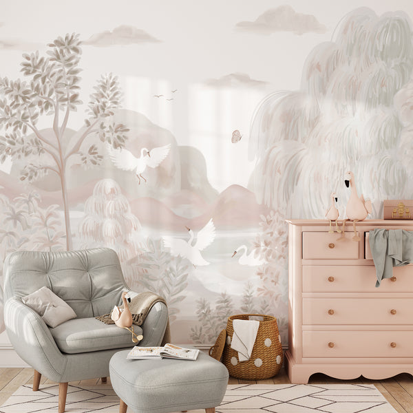 Pastel wall mural featuring elegant white swans, soft willow trees, distant mountains and water in blush, beige and muted green tones.