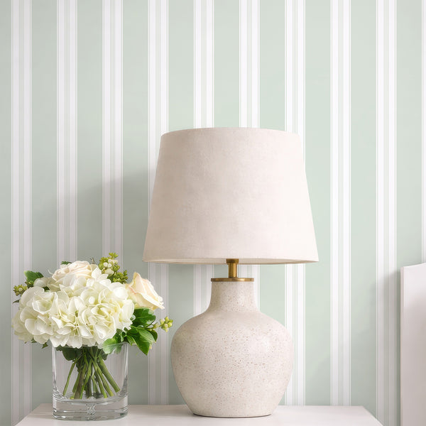 Sage green pinstripe wallpaper featuring crisp white vertical stripes and fine linear accents for a minimalist bedroom, nursery, or home office.