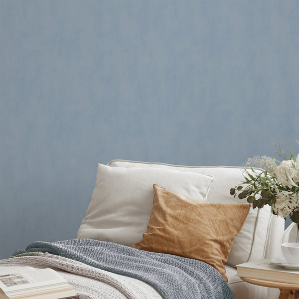 Dusty blue plaster look wallpaper with a serene limewash effect, perfect for minimalist bedrooms and living rooms.