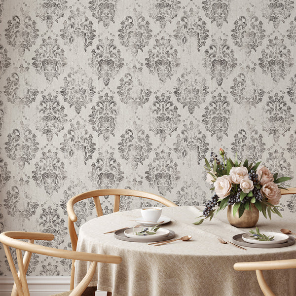 A classic damask pattern with medallion motifs in charcoal tones, set against a warm gray ground. The distressed finish adds a vintage touch, making it suitable for a French country or modern classic living space.