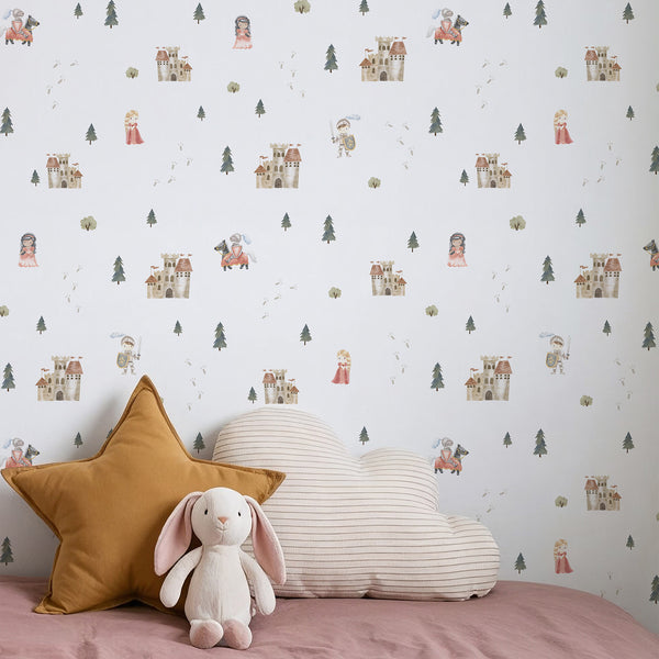 Medieval kingdom wallpaper with small castles, knights, princesses and forest trees in muted green, beige and dusty pink tones for a whimsical nursery.