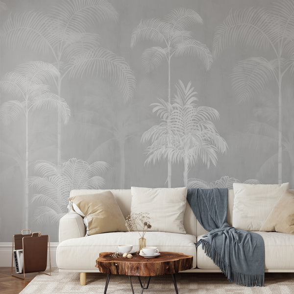 Gray tropical palm tree wallpaper with soft white palms and layered botanical foliage for a neutral modern bedroom or living room accent wall.